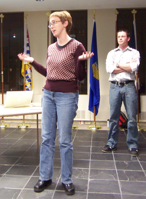 Amber Rhea pitching Podcamp Atlanta to the Atlanta PHP User Group as Robert Swarthout looks on.